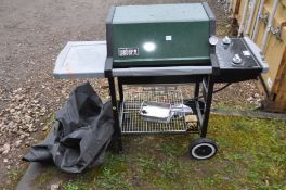A WEBER SILVER GAS BARBECUE with two burners, side extension, undershelf, tools and cover enclosure,