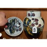 TWO PIECES OF MOORCROFT SECONDS DECORATED IN A BRAMBLE PATTERN, comprising a ginger jar and cover,