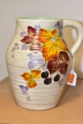 A CLARICE CLIFF WILKINSON LTD HANDLED MOULDED AND RIBBED VASE PAINTED WITH BLACKBERRIES AND