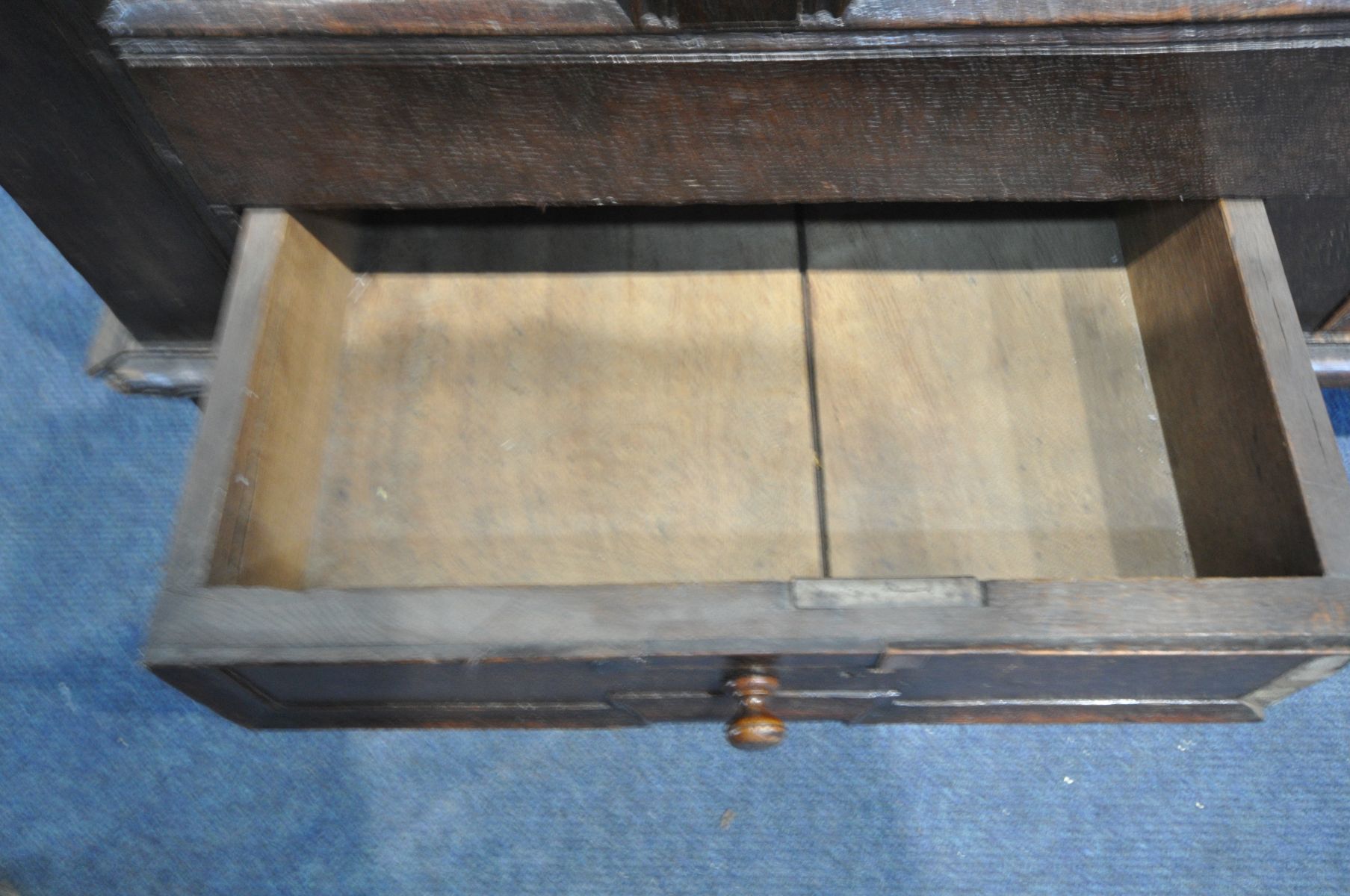 AN 18TH CENTURY OAK MULE CHEST, the hinged plank top enclosing a candle box, and panelled front - Image 5 of 5