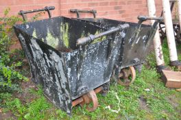 A PAIR OF VINTAGE ENCLOSED COAL TROLLEYS steel in construction with handles both ends and four