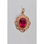 A YELLOW METAL SYNTHETIC RUBY PENDANT, designed with a central oval cut synthetic ruby,