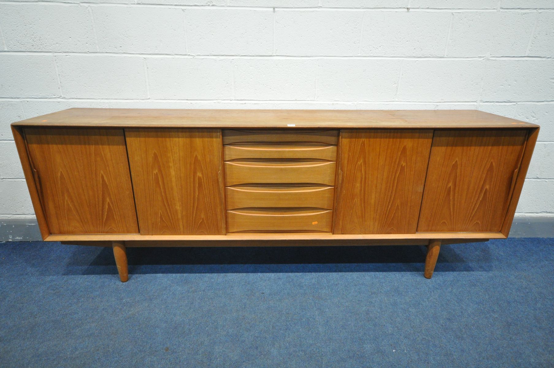 A MID CENTURY DANISH TEAK SIDEBOARD, possibly 'Dyrlund' that's inspired by Arne Vodder's Triennale