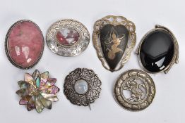 A SCOTTISH SILVER BROOCH AND ASSORTED WHITE METAL BROOCHES, a round open work brooch featuring a