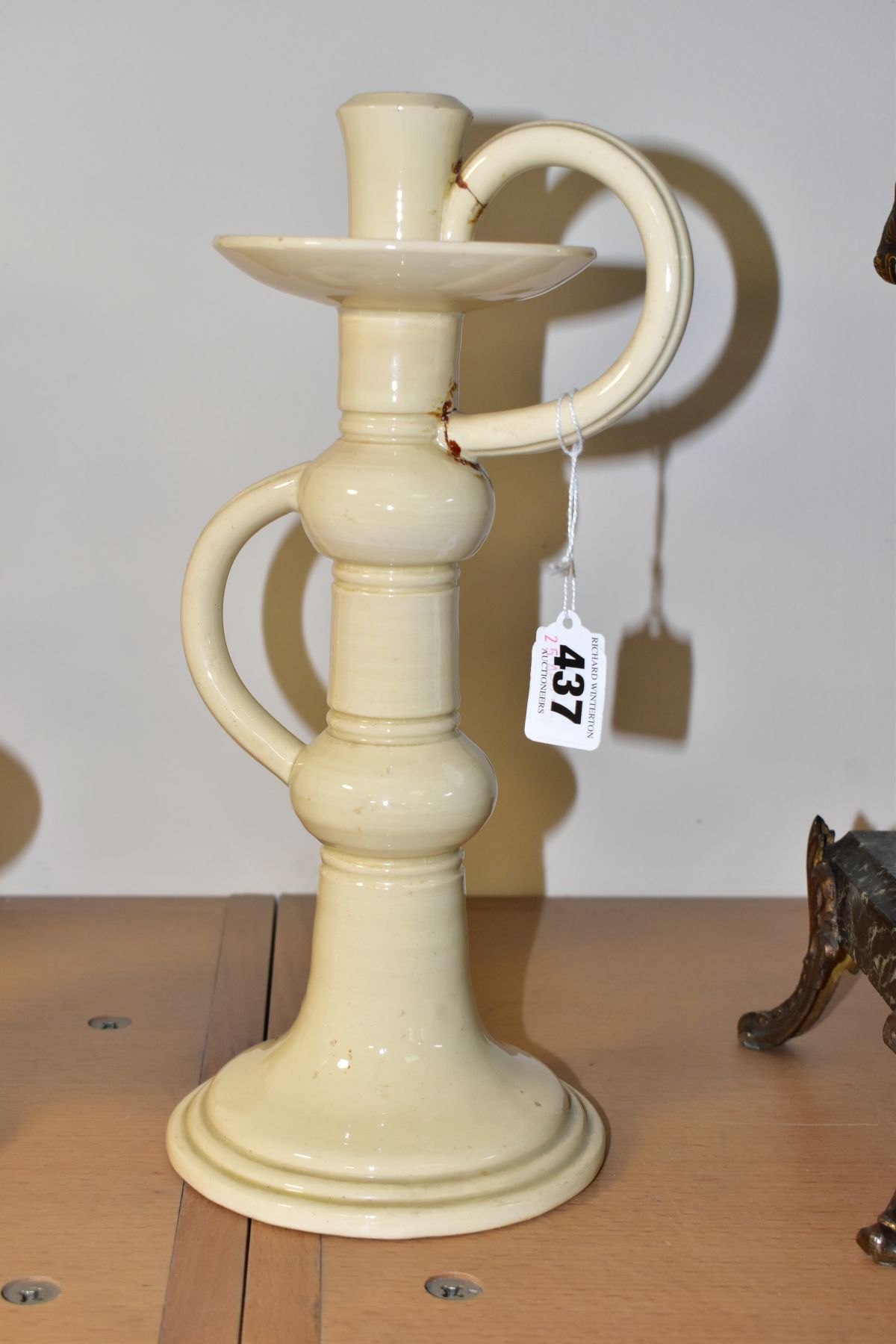 A WILEMAN & CO FOLEY FAIENCE ART POTTERY CANDLESTICK IN A CREAM 'SPANO-LUSTRA' GLAZE, with two