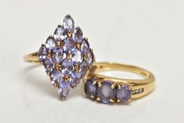 A 9CT GOLD TANZANITE RING AND A SILVER GILT RING, the first designed with three oval cut tanzanite's