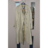 A LADIES DOUBLE BREASTED BURBERRY THREE QUARTER LENGTH TRENCH COAT, khaki / stone outer with