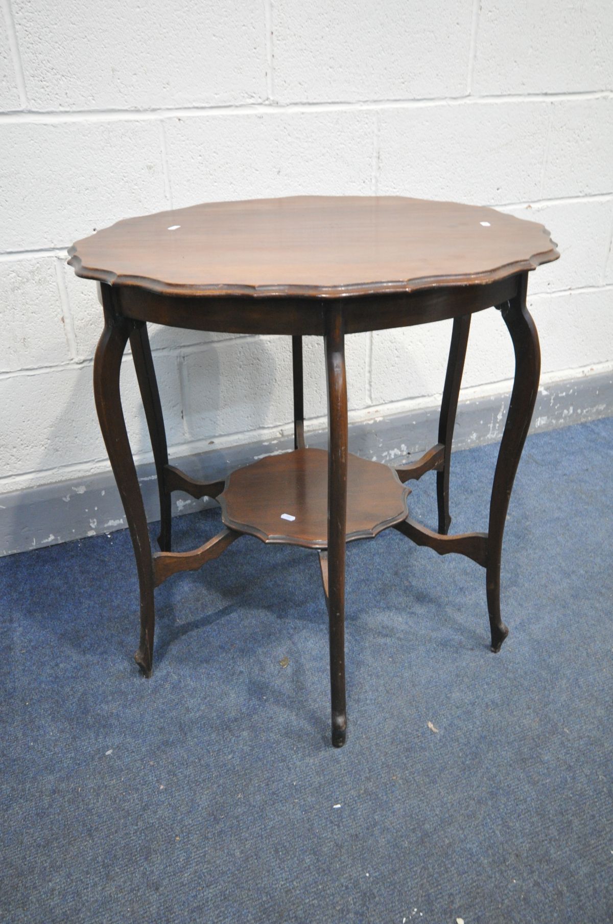 AN EARLY 20TH CENTURY MAHOGANY CENTRE TABLE, with wavy edges, united by a similar undershelf, - Image 2 of 3