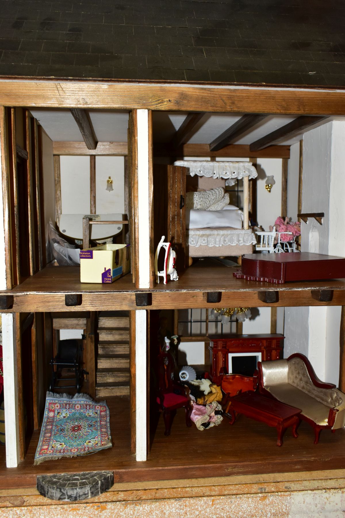 A DOLLS HOUSE, exterior in Tudor style, with four rooms, hallway, stairs and landing, a two - Image 3 of 5