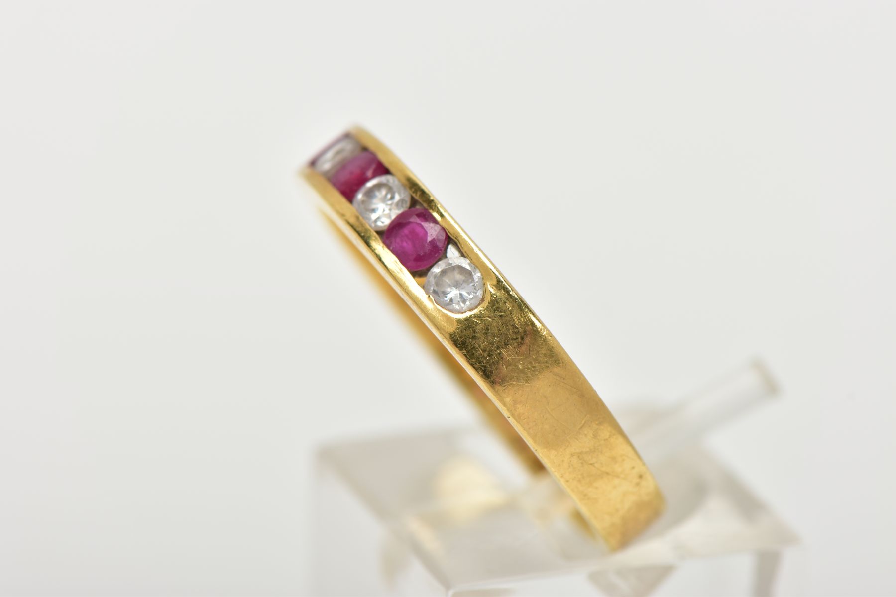 A RUBY AND DIAMOND HALF HOOP RING, yellow metal band, designed with a row of three channel set - Image 2 of 4