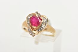 A YELLOW METAL GEM SET RING, of a heart design set centrally with a synthetic heart cut ruby, in a