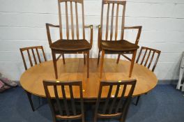 A WILLIAM LAWRENCE TEAK OVAL EXTENDING DINING TABLE, open length 199cm x closed length 158cm x depth