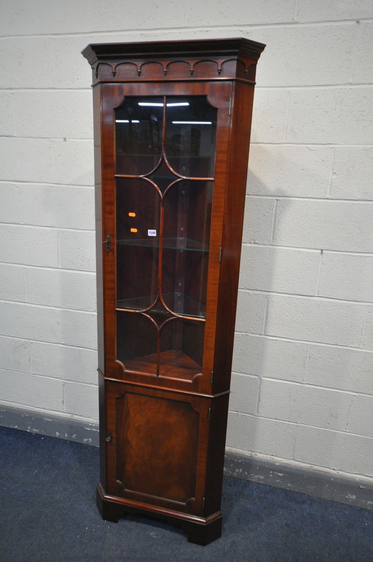 A TALL MAHOGANY GLAZED CORNER CUPBOARD, width 65cm x depth 39cm x height 199cm (key)