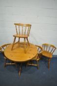 A PINE CIRULAR KITCHEN TABLE, diameter 108cm x height 73cm, with four bow top chair (5)