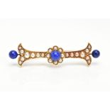 A VICTORIAN GOLD, LAPIS LAZULI AND SEED PEARL BROOCH, yellow gold brooch designed with a central