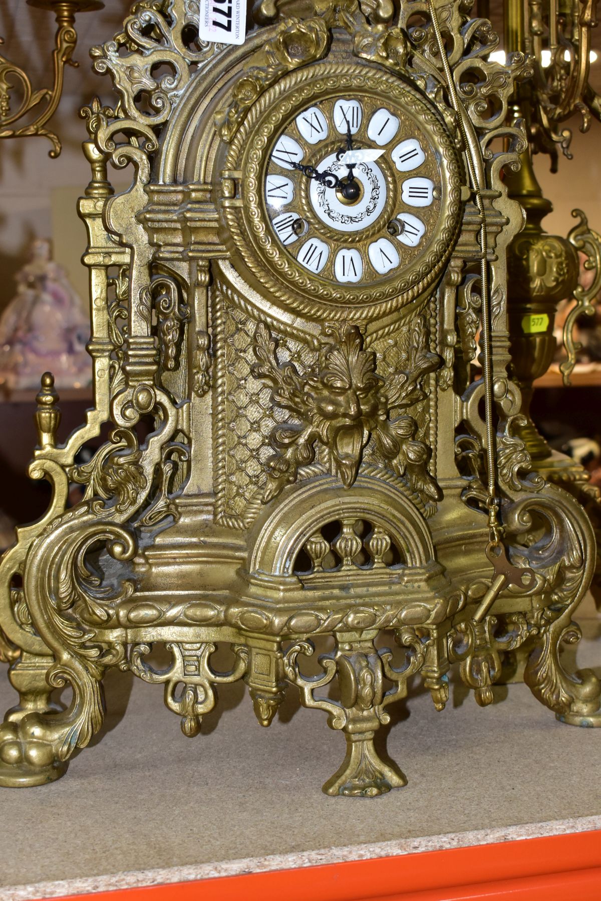 A REPRODUCTION BRASS CLOCK GARNITURE, the clock with ornate cast brass case with twin handled urn - Image 5 of 9