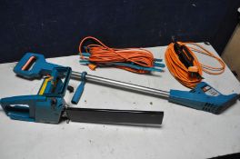 A BLACK AND DECKER POWER WEEDER model No W100 and a Black and Decker chainsaw with one power cable