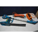 A BLACK AND DECKER POWER WEEDER model No W100 and a Black and Decker chainsaw with one power cable