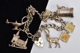 A SILVER CHARM BRACELET, fancy curb link chain, fitted with seven charms in forms such as a