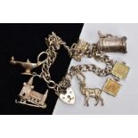 A SILVER CHARM BRACELET, fancy curb link chain, fitted with seven charms in forms such as a