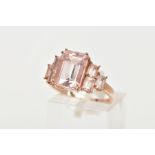 A 9CT ROSE GOLD MORGANITE DRESS RING, of a tiered design, set with a central rectangular cut