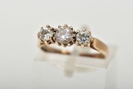 A 9CT GOLD THREE STONE RING, set with three circular cut cubic zirconia, each in a claw setting,