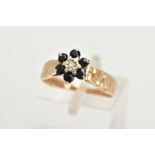 A 9CT GOLD SAPPHIRE AND DIAMOND CLUSTER RING, of a flower design set with a central single cut
