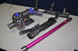 A DYSON V6 ABSOLUTE Dyson cordless vacuum with charger and accessories (PAT pass and working)
