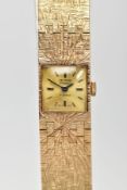 A LADIES 9CT GOLD 'DELVINA' WRISTWATCH, hand wound movement, square gold dial signed 'Delvina,
