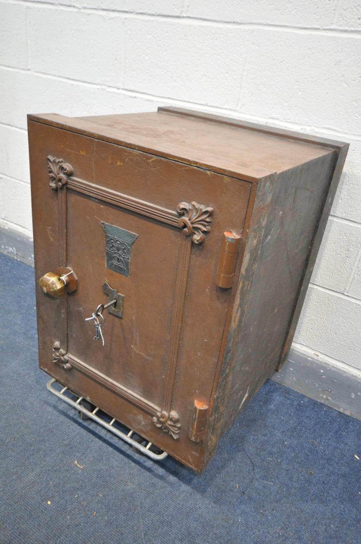A 19TH CENTURY CAST IRON SAFE, made by Milner's Patent, later partially brown overpainted, brass