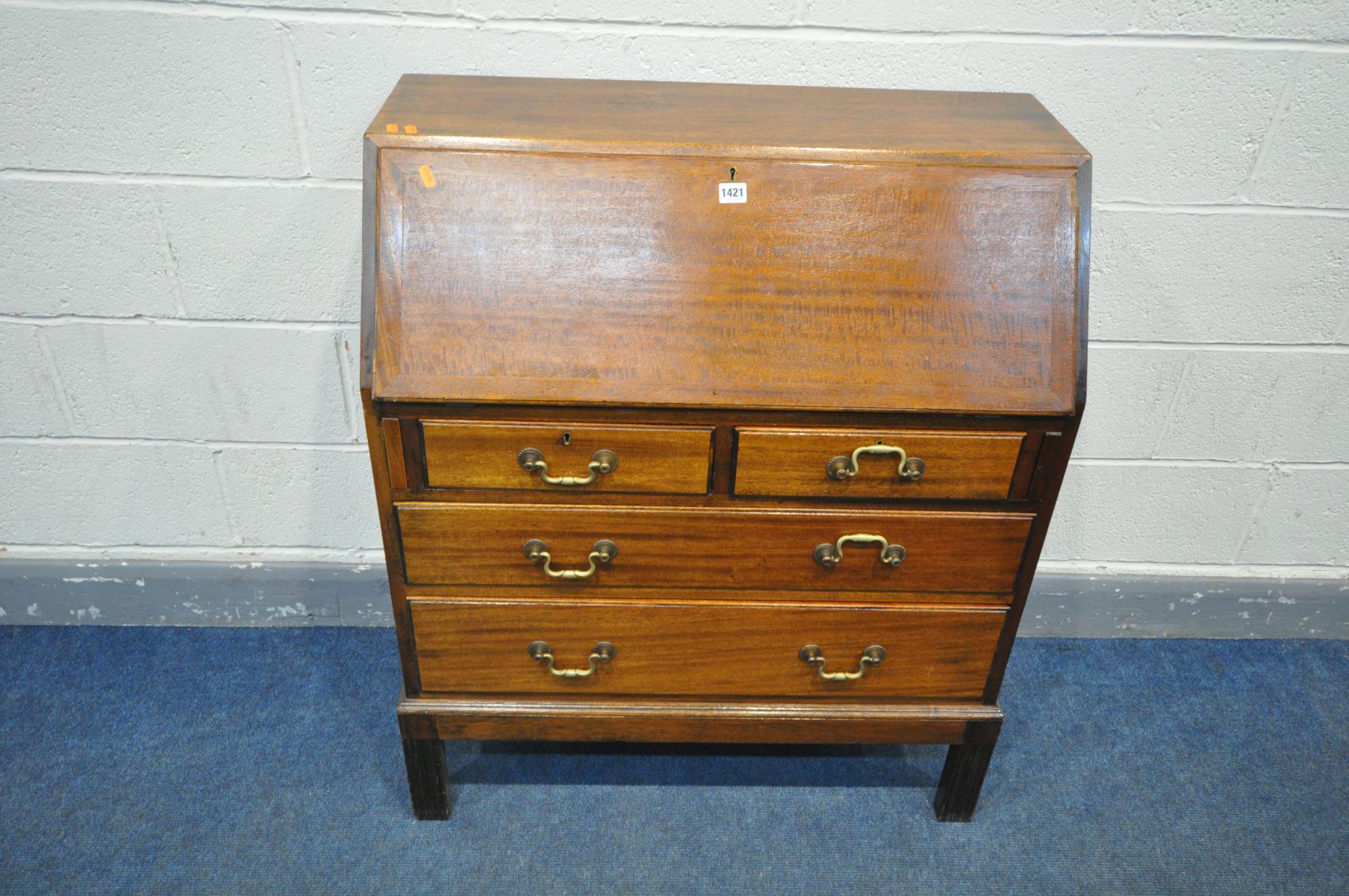 A MAHOGANY BUREAU, with four drawers, width 84cm x depth 42cm x height 101cm (condition:-losses
