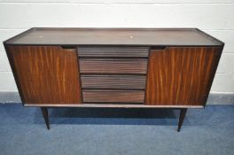 A RICHARD HORNBY FOR FYNE LADYE AFROMOSIA TEAK SIDEBOARD, with double cupboard doors, flanking