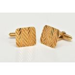 A PAIR OF 9CT GOLD CUFFLINKS, yellow gold square face with a chevron diamond cut pattern, fitted