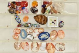 A BOX OF ASSORTED GEMSTONES AND CAMEOS, to include a large carved tigers eye, fourteen shell cameos,