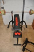 A WEIDER WEIGHTLIFTING BENCH model No FB200 with bar and 16kg of York weights comprising of two 4.