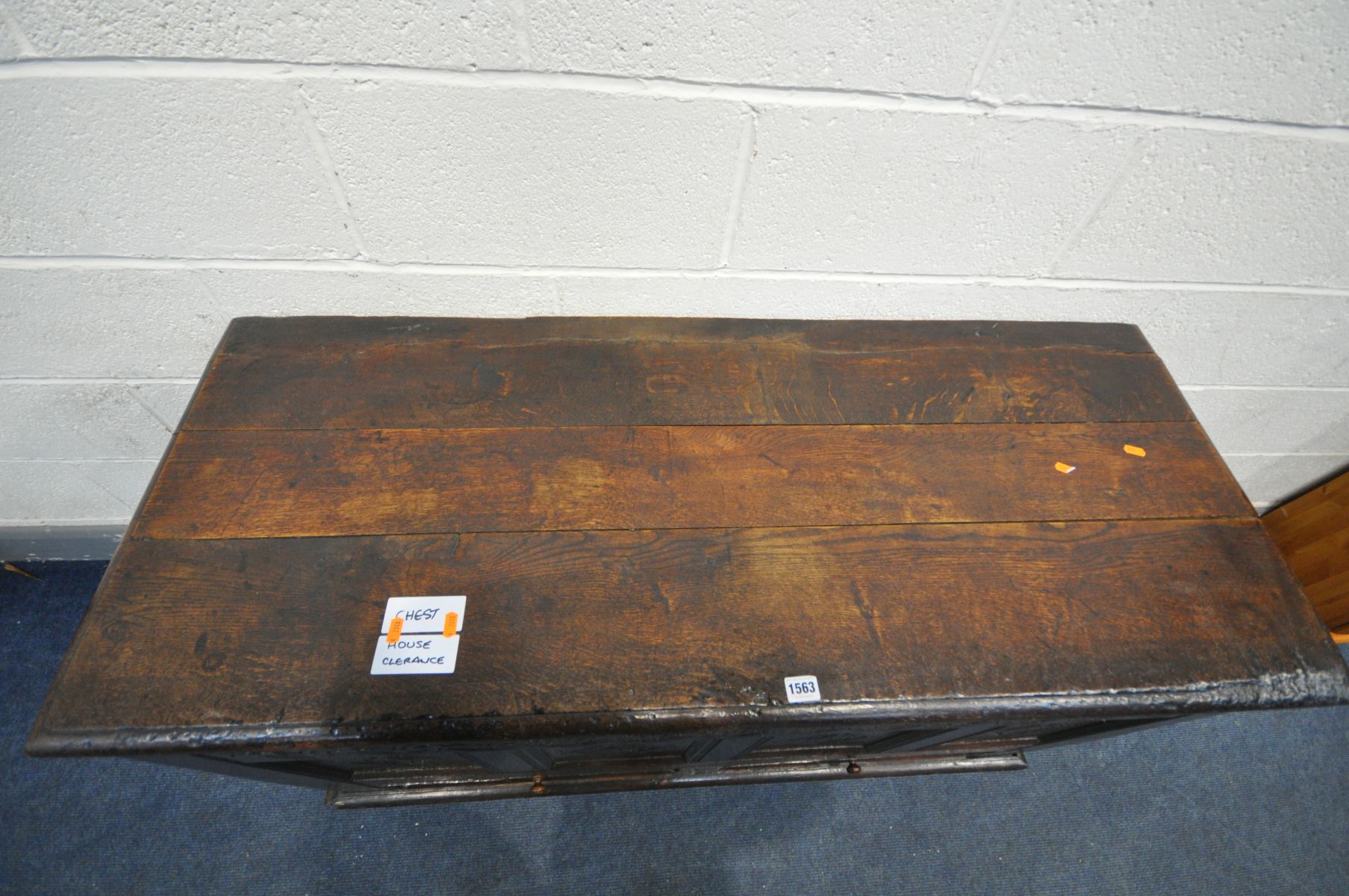 AN 18TH CENTURY OAK MULE CHEST, the hinged plank top enclosing a candle box, and panelled front - Image 2 of 5