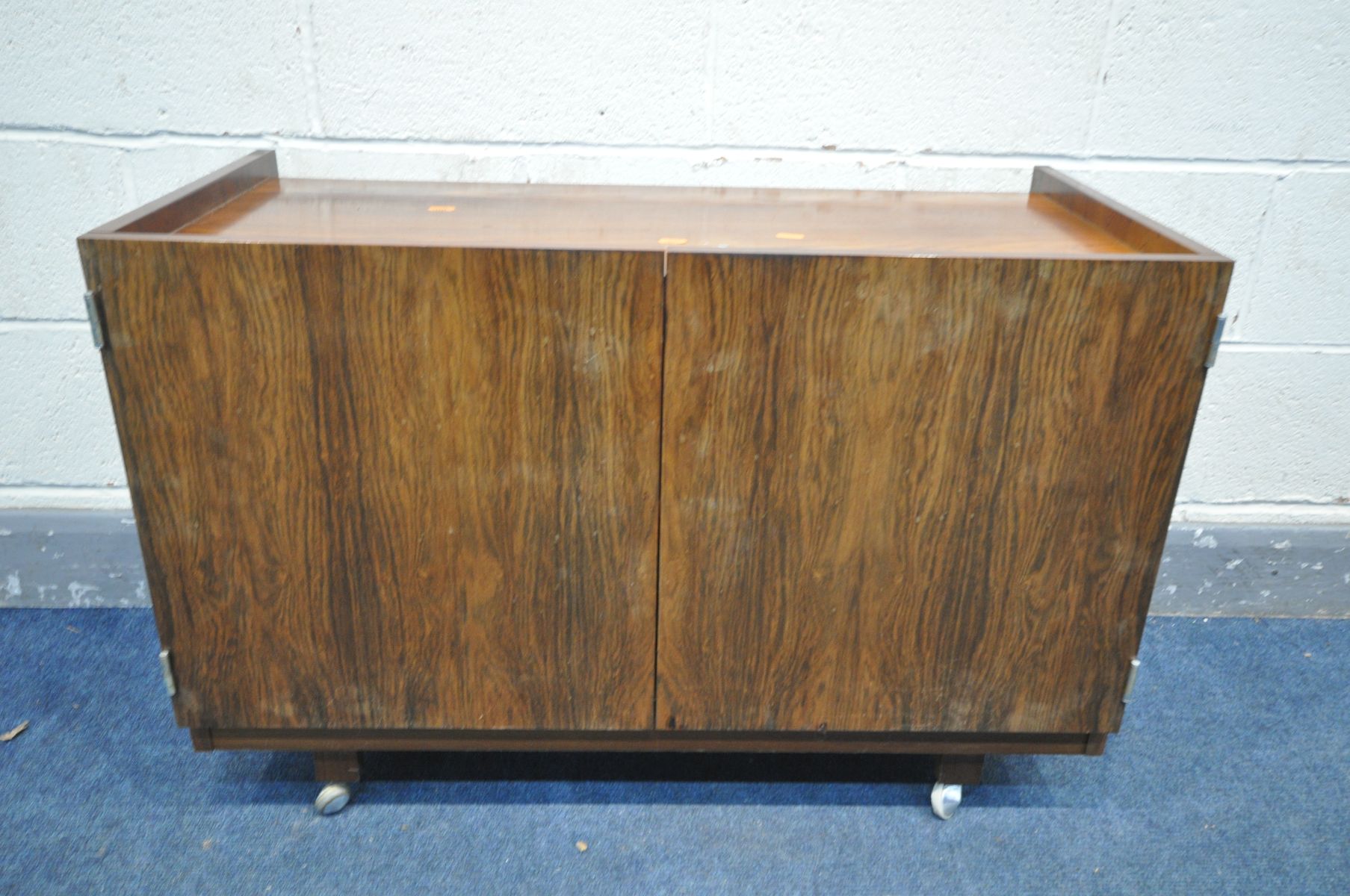 A DANISH 1960'S/70'S ROSEWOOD ROLLING TWO DOOR CABINET, unlabelled, width 91cm x depth 44cm x height