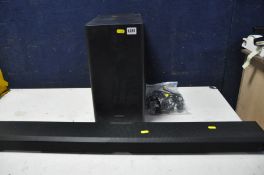 A SAMSUNG SOUNDBAR AND BASS BOX with remote, soundbar model No HW-Q800T bass box model No PS-