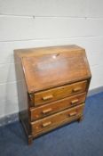 AN EARLY TO MID 20TH CENTURY OAK BUREAU, with a fitted interior, and three exterior drawers, width