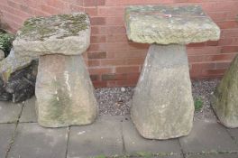 TWO COMPOSITE STADDLE STONE BASES one with a square composite top the other with a sandstone top,