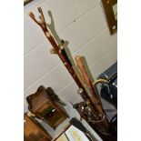 A GROUP OF WALKING STICKS, CANES AND RIDING CROPS IN AN ORIENTAL BRUSH POT, seventeen pieces to