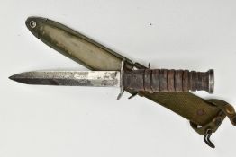 AMERICAN WORLD WAR TWO ERA M3 FIGHTING KNIFE, in metal and canvas scabbard, the knife cross guard is