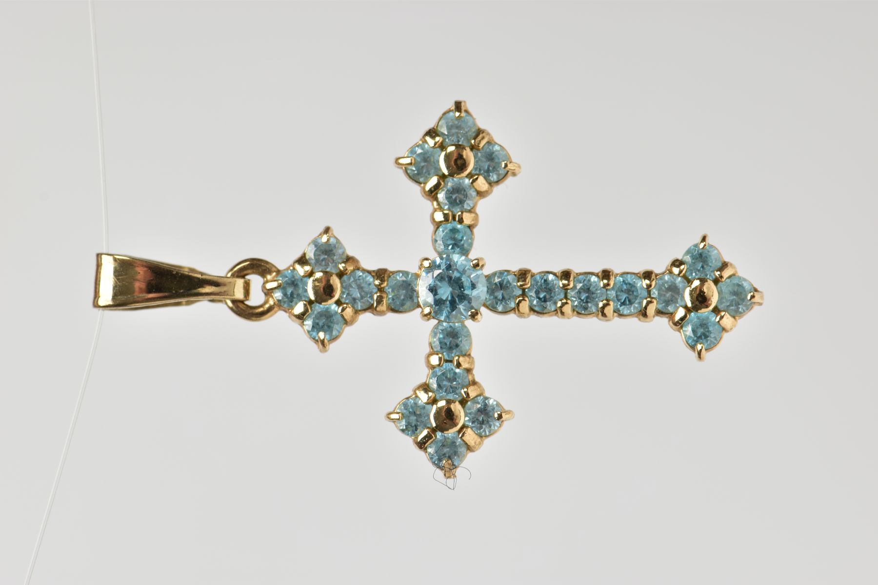 A 9CT GOLD TOPAZ CROSS PENDANT, twenty four circular cut topaz stones prong set in yellow gold,