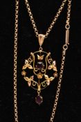 AN EARLY 20TH CENTURY GOLD LAVALIER NECKLACE, yellow gold open work floral and foliage pendant set