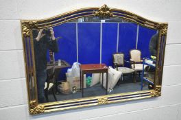 A LATE 20TH CENTURY GILT FRAMED FRENCH STYLE OVERMANTEL MIRROR, with mirrored frame, 129cm x 89cm