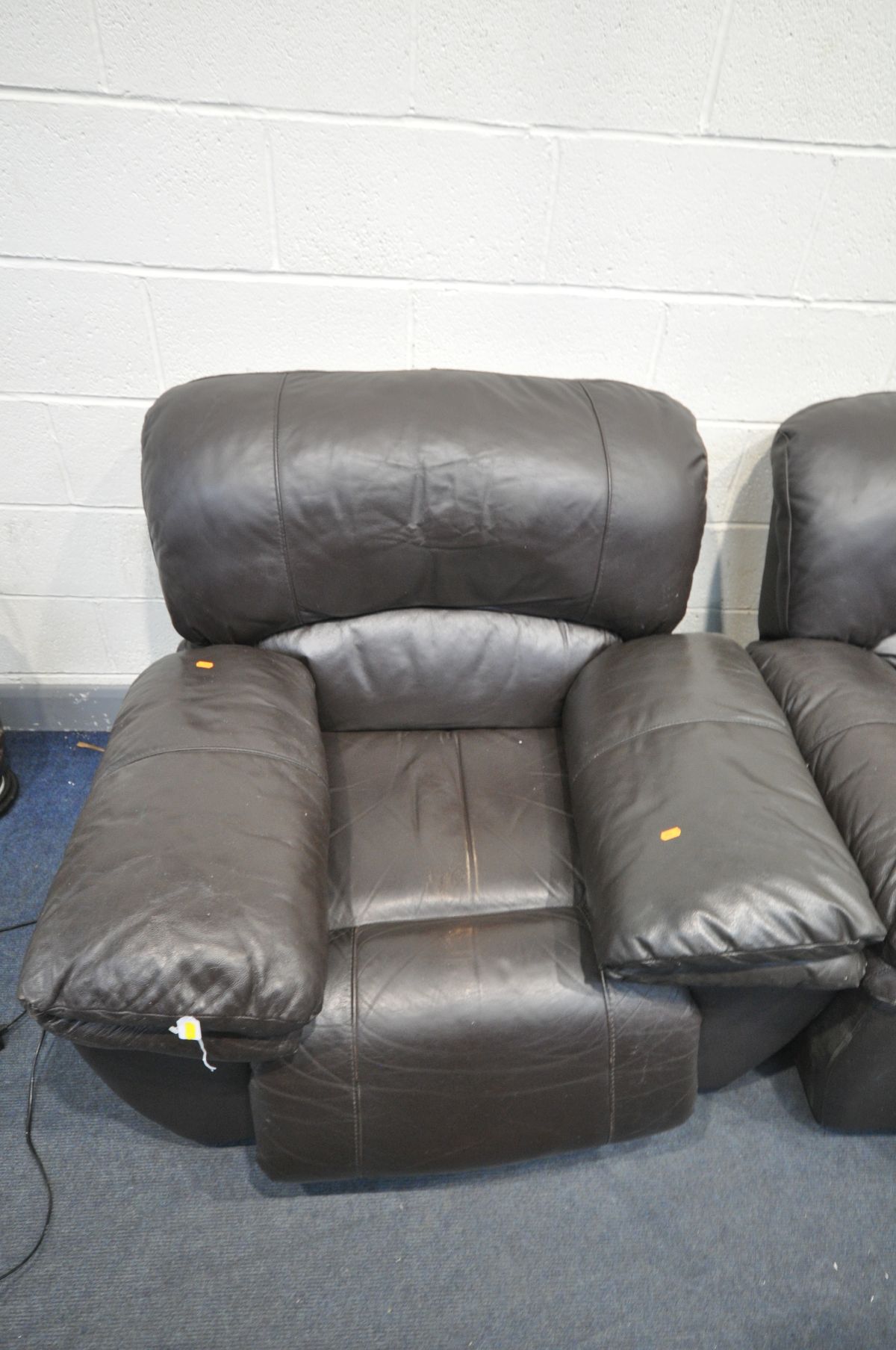 A BROWN LEATHER TWO PIECE LOUNGE SUITE, comprising of a two seater manual recliner and an electric - Image 2 of 3