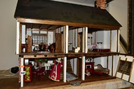 A DOLLS HOUSE, exterior in Tudor style, with four rooms, hallway, stairs and landing, a two