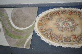 AN OVAL CHINESE WOOLLEN RUG, 194cm x 132cm, and a Dunelm style Mirage woollen rug, 232cm x 162cm,
