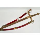 TWO ASIAN/INDIAN TOURIST STYLE CURVED SWORDS in wooden and suede scabbards, one id marked made in