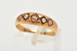 A LATE VICTORIAN 18CT GOLD RING, designed with four seed pearls and a central colourless bead (